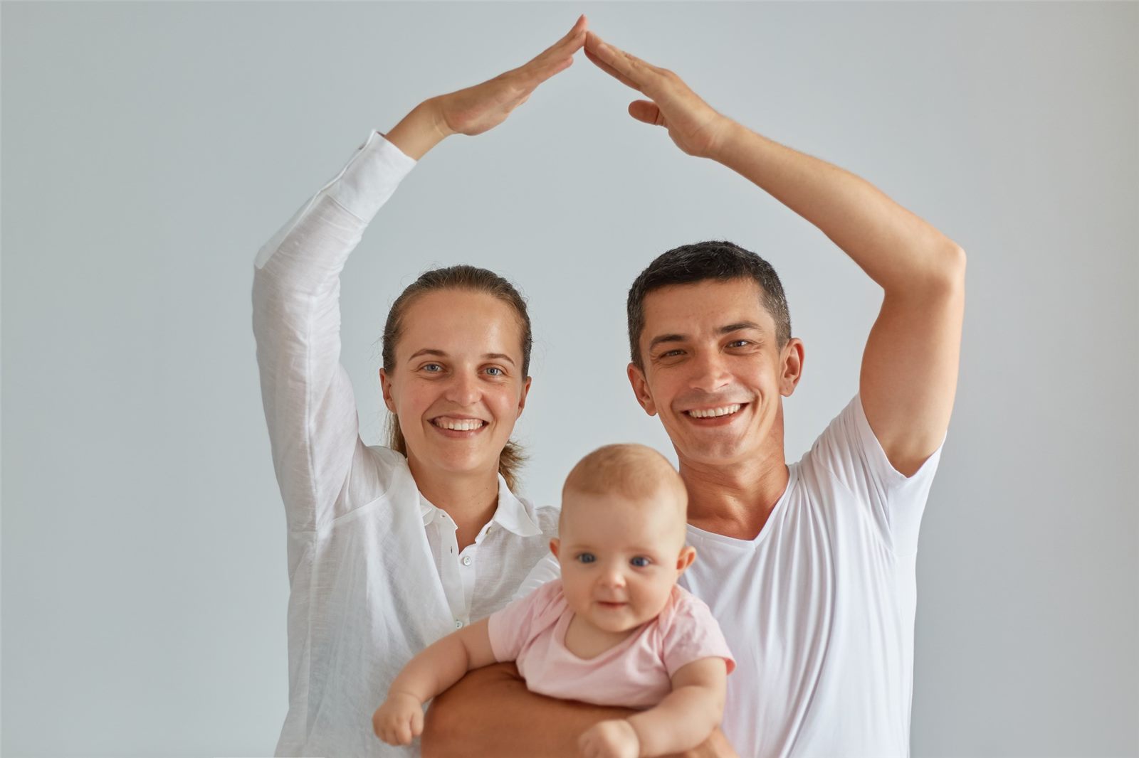 Smiling family with a baby