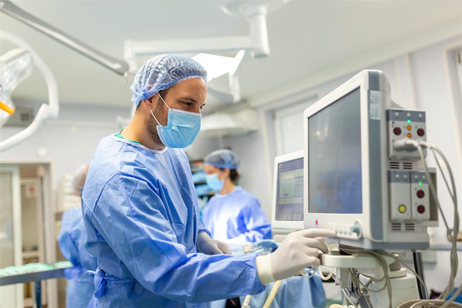 Clinician using advanced medical monitoring equipment